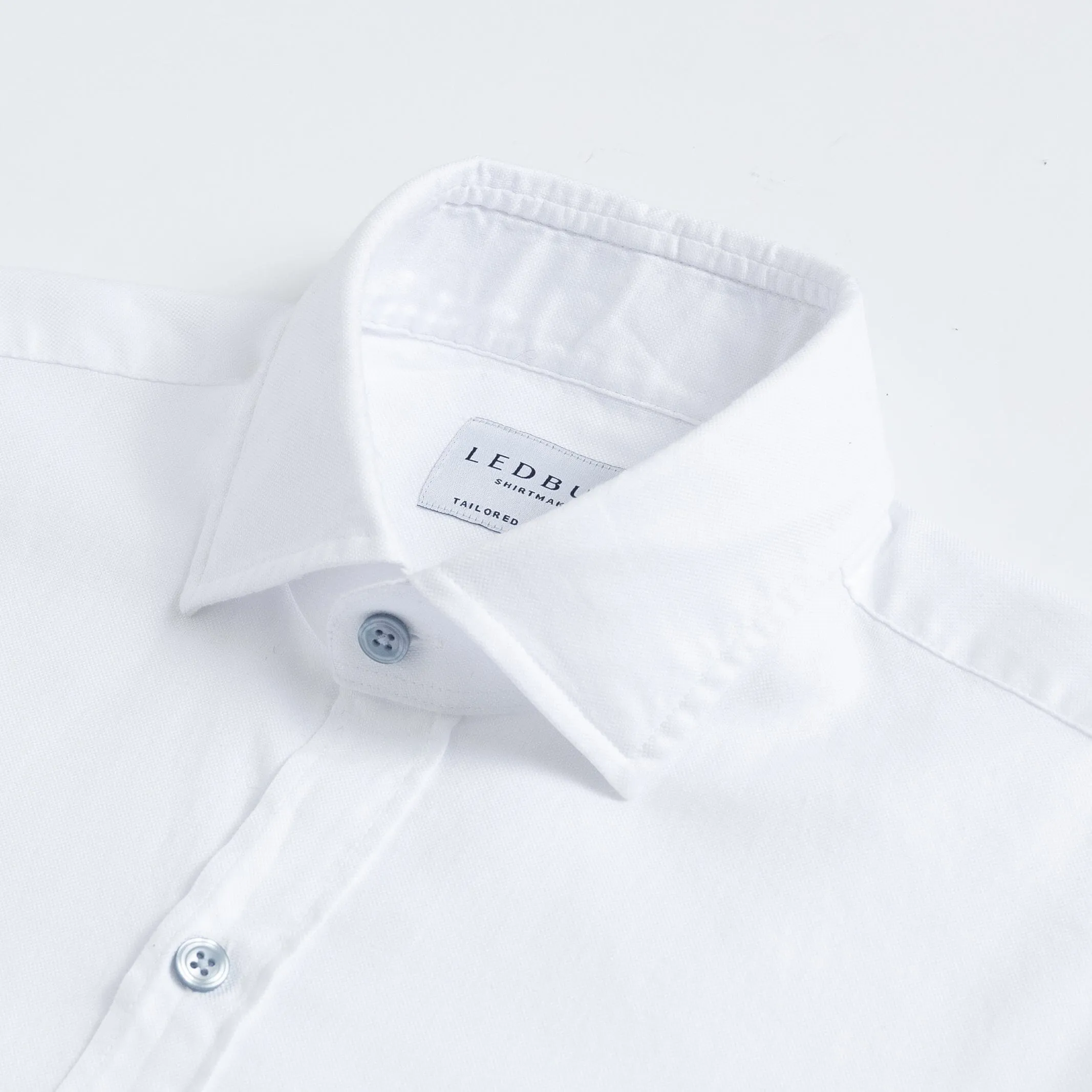 The White Asbury Oxford Soft Shirt with Blue Buttons